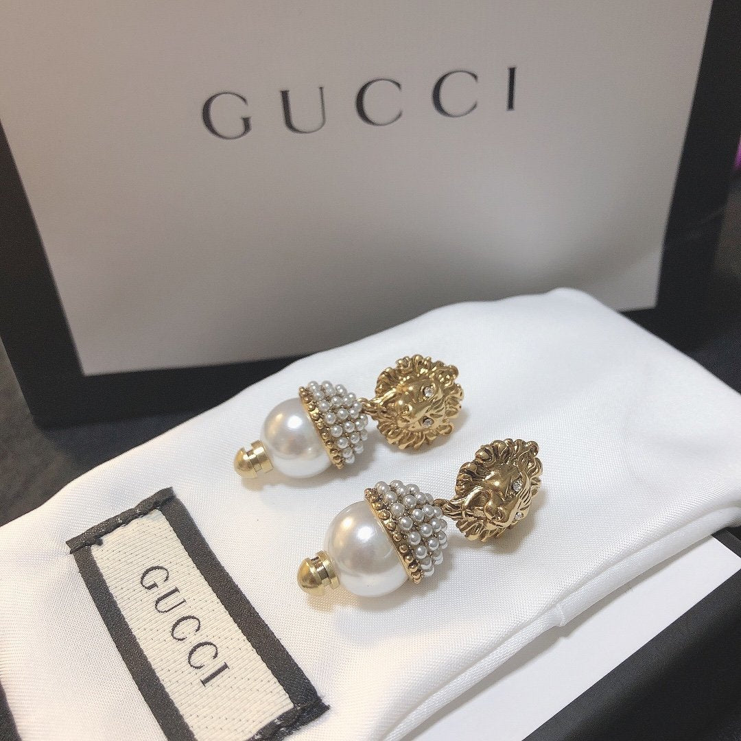 Lion head pearl earrings