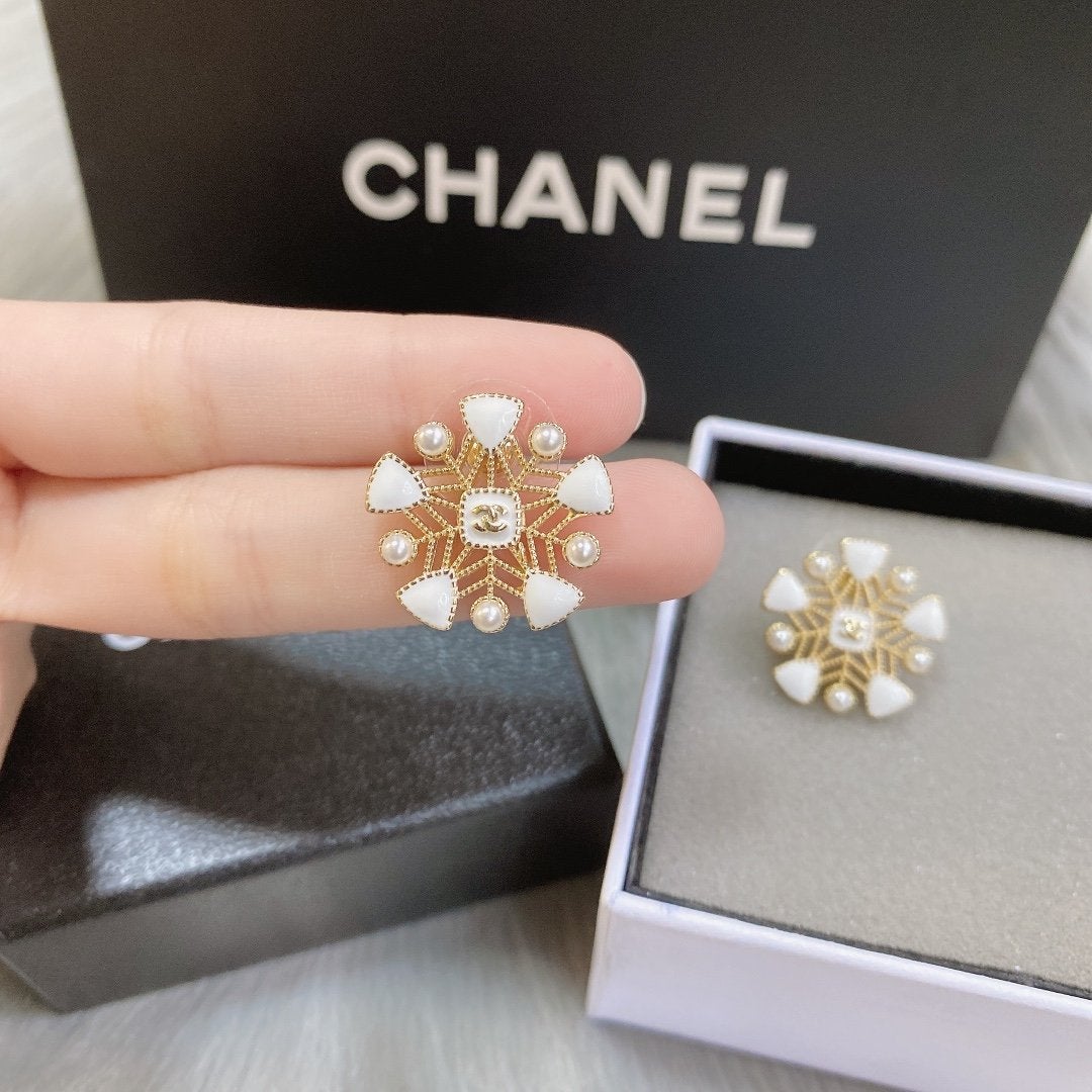 White snowflake hollow earrings