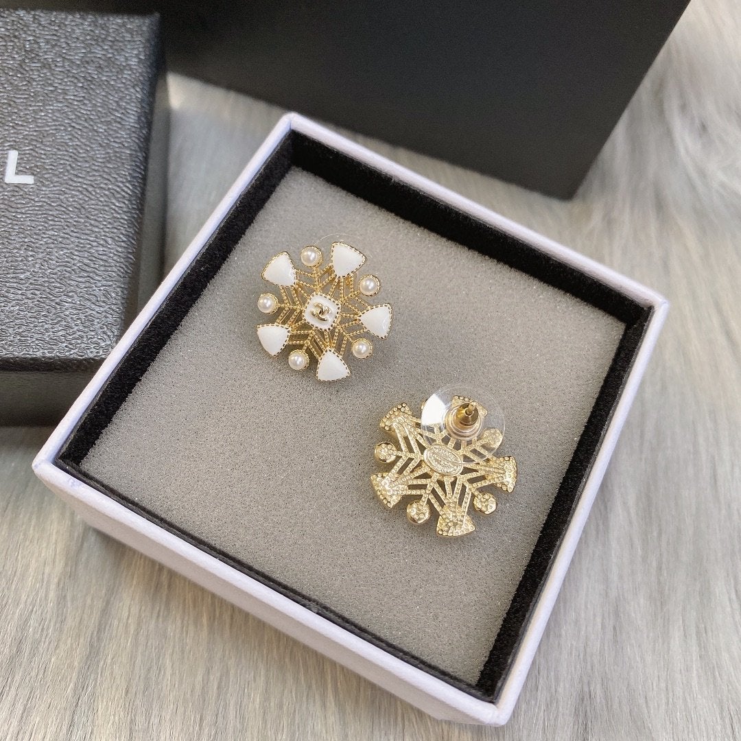 White snowflake hollow earrings