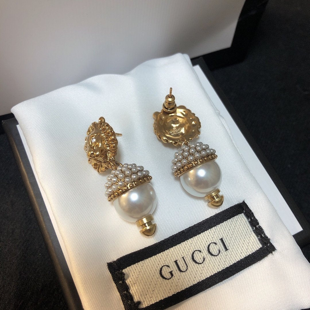 Lion head pearl earrings