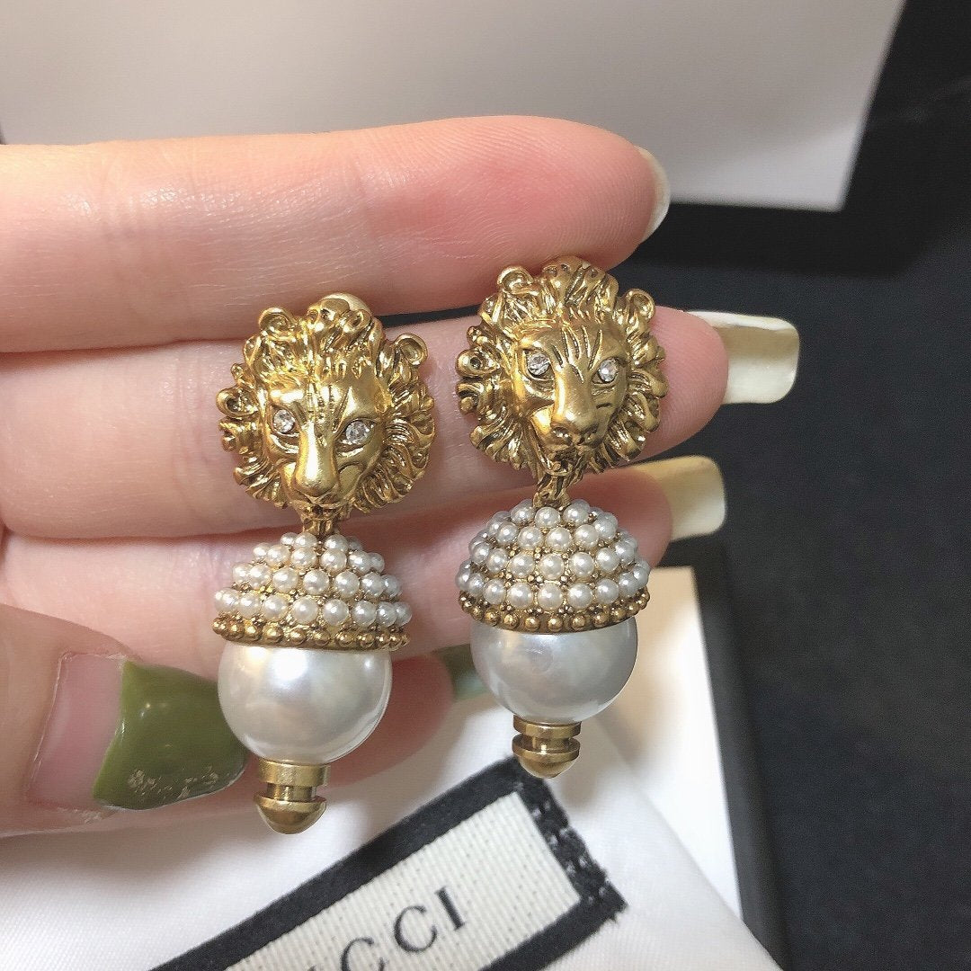 Lion head pearl earrings