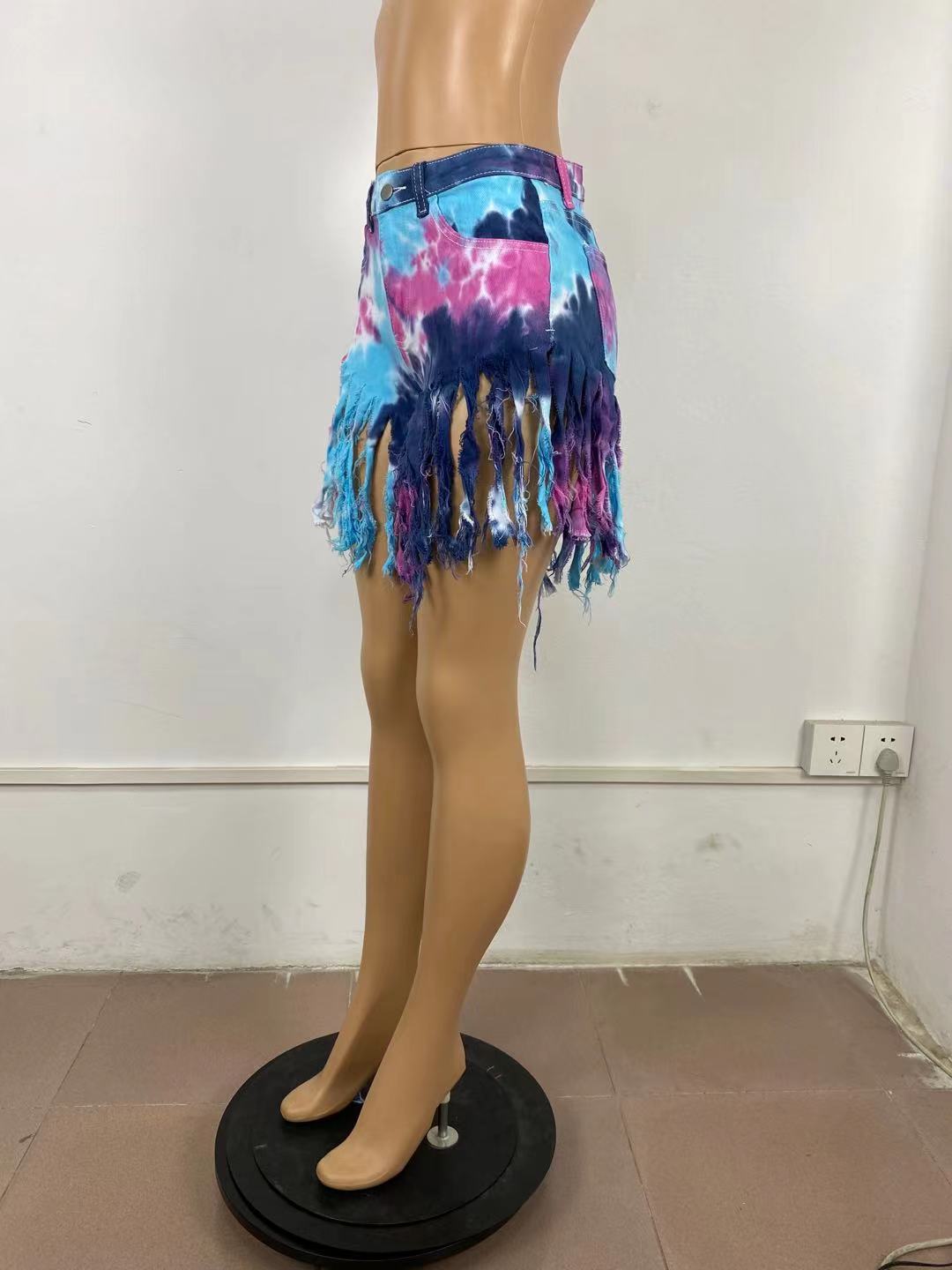 Tie dyed denim shorts with tassels