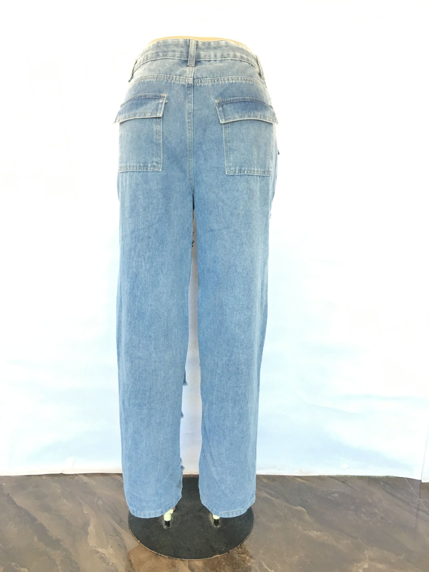 Fashionable loose fitting high waisted wide leg torn jeans