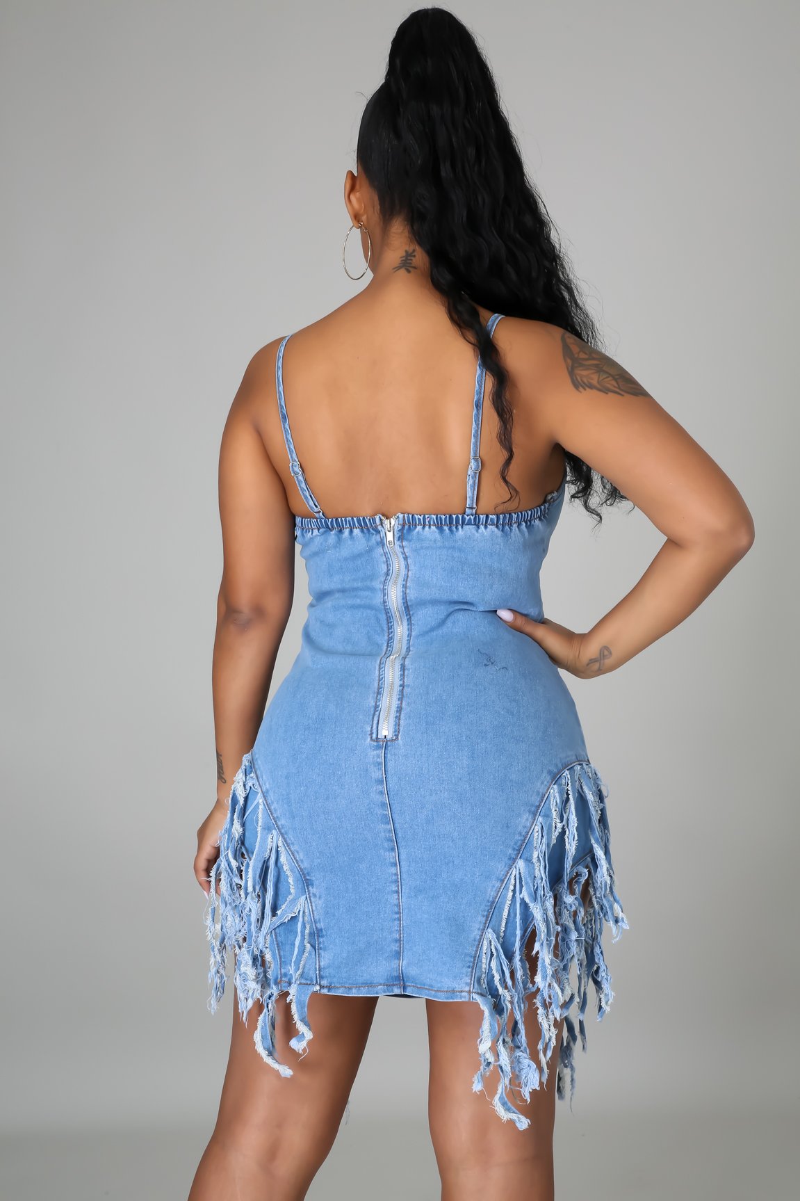Fashionable open back denim skirt with strap