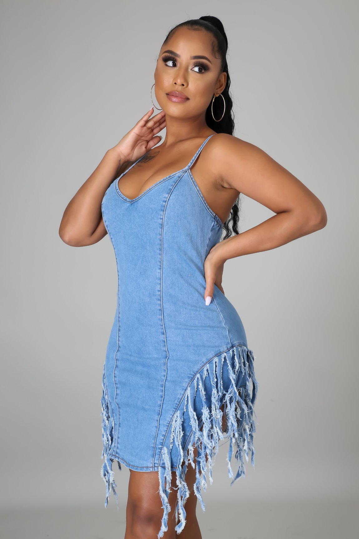 Fashionable open back denim skirt with strap