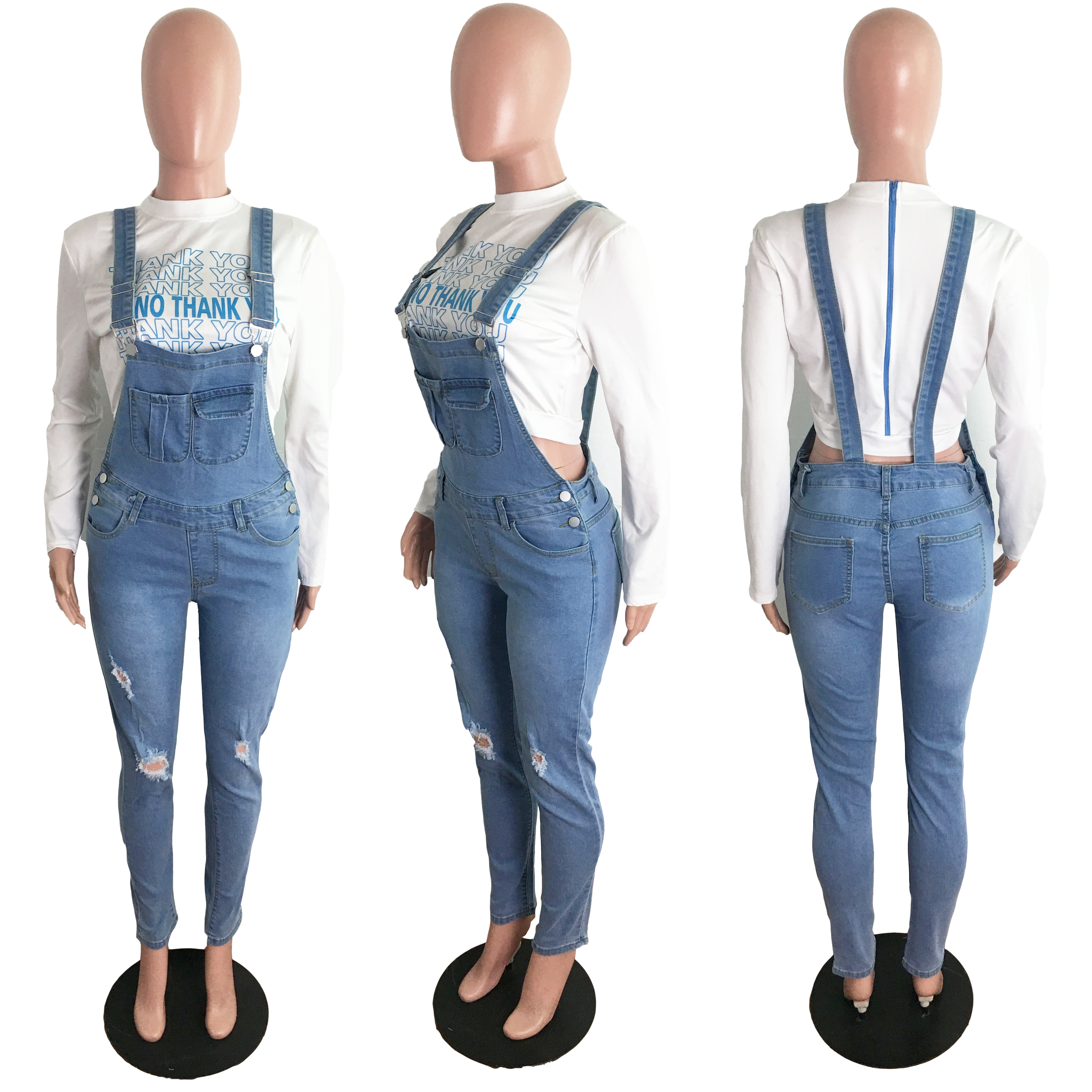 Holed jeans and suspenders