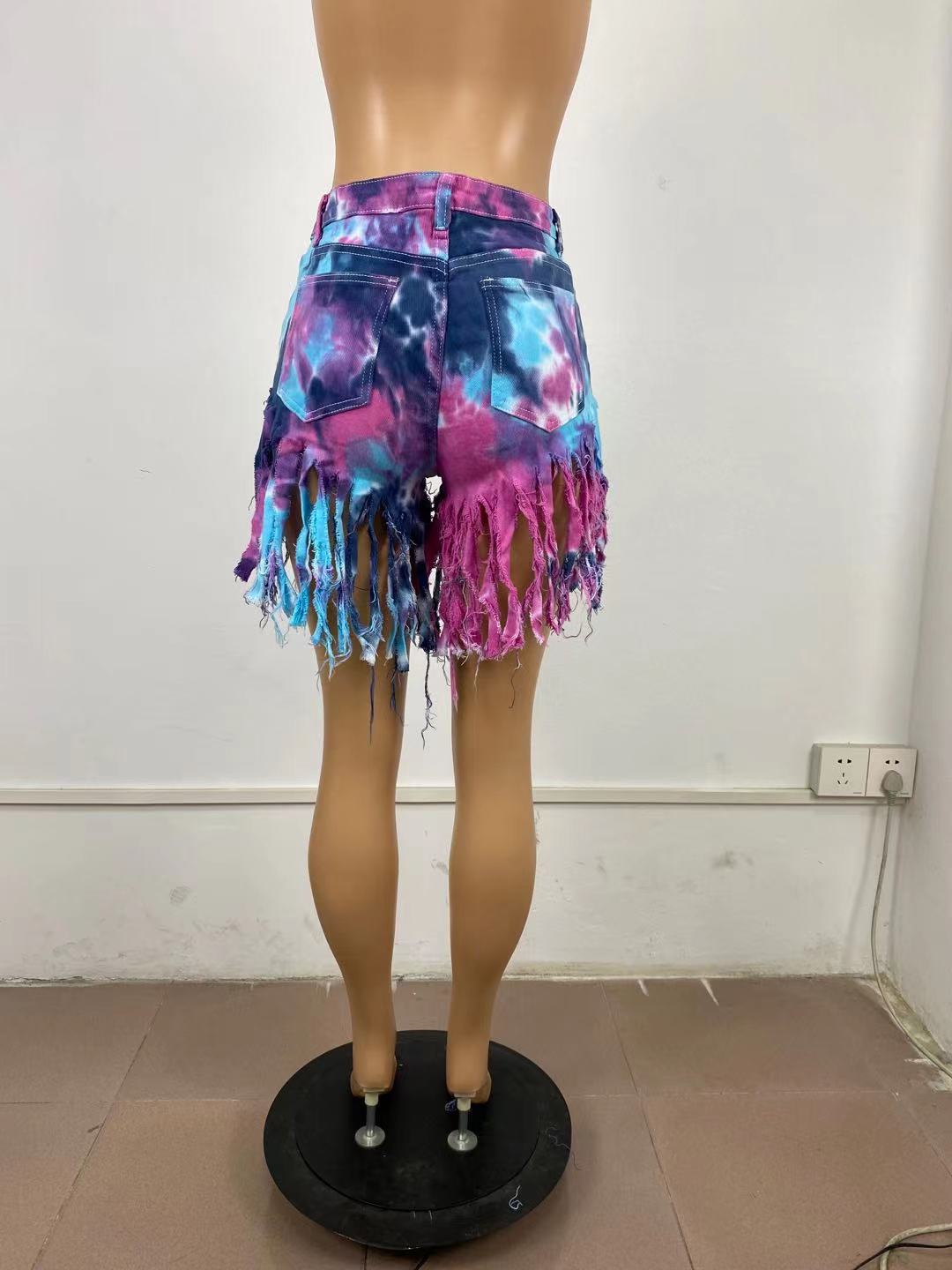 Tie dyed denim shorts with tassels