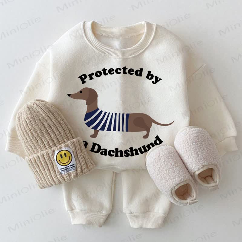 PROTECTED BY A  DACHSHUND Baby 2-piece White Set